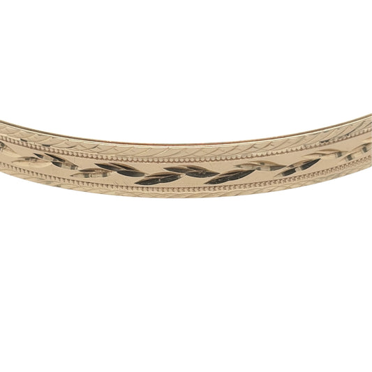 This pre-owned 9ct yellow solid gold patterned bangle is a substantial design, featuring decorative detailing across its warm yellow gold finish.
Design: Featuring decorative patterned detailing, this bangle has a classic profile with a traditional yellow gold finish.
Material: Made from solid 9-carat yellow gold.
Bangle Detail: The bangle measures approximately 6.5mm wide.
Size & Weight: Bangle measures approximately 6.7cm in diameter. Total weight 10.30 grams.