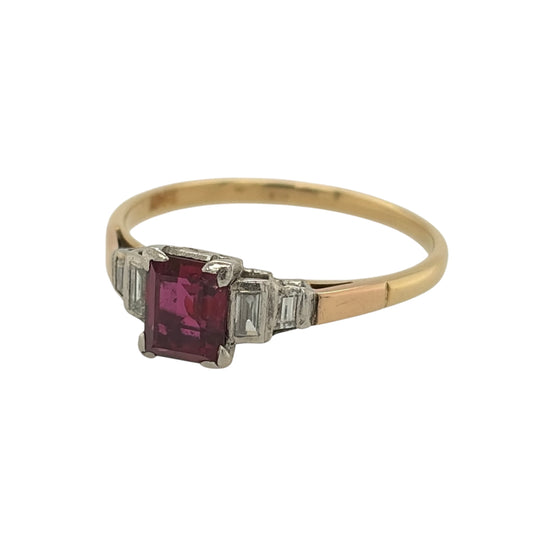 This pre-owned 18ct yellow gold diamond and ruby vintage-style ring is a distinctive gemstone design, featuring an emerald cut ruby with baguette cut diamond detailing.
Design: Featuring a vintage-style setting, this ring showcases a central emerald cut ruby with two baguette cut diamonds set on either side in warm 18ct yellow gold.
Material: Made from 18-carat yellow gold.