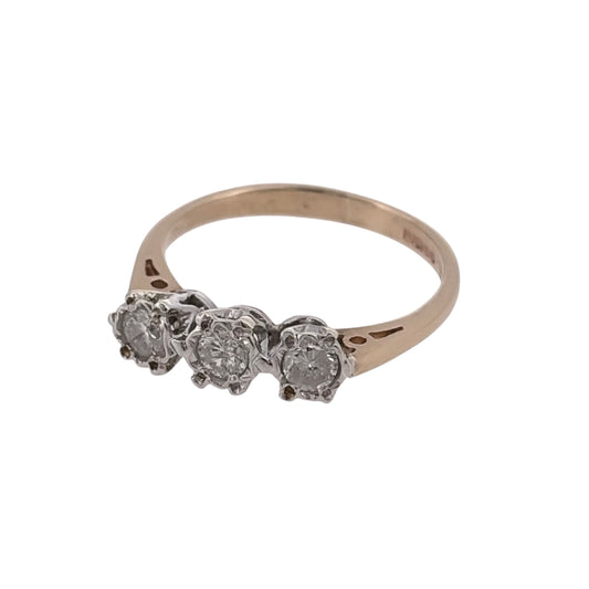 Add classic diamond detail to your jewellery collection with this pre-owned 9ct yellow gold trilogy ring, featuring three illusion-set diamonds in a timeless three-stone design.
Design: The ring features a traditional trilogy design, with three diamonds arranged across the front to create a balanced and elegant appearance.
Material: Made from 9-carat yellow gold, the warm gold tone provides a classic setting for the diamond detailing.