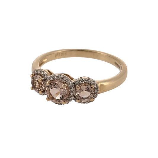 Add an elegant touch to your jewellery collection with this pre-owned 9ct yellow gold diamond and morganite cluster trilogy ring, featuring three delicate pink morganite stones surrounded by diamond halo detailing.
Design: The ring features a trilogy cluster design, with three round pink morganite stones, each surrounded by a decorative halo, creating a beautiful and feminine appearance.
Material: Made from 9ct yellow gold, offering a warm gold finish that complements the soft pink morganite stones.