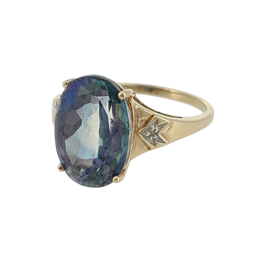 Add a colourful statement piece to your jewellery collection with this pre-owned 9ct yellow gold diamond and blue mystic topaz ring, featuring a striking oval gemstone complemented by elegant diamond detailing.
Design: The ring features a classic oval gemstone design, with a prominent blue mystic topaz stone and decorative diamond detailing creating an attractive and distinctive appearance.
