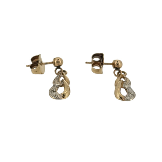 Add an elegant touch to your jewellery collection with these pre-owned 9ct yellow gold and diamond loop drop earrings, featuring a decorative loop-inspired design complemented by delicate diamond detailing.
Design: The earrings feature a stylish loop drop design, combining elegant curved gold detailing with diamonds to create an attractive and timeless appearance.
Material: Made from 9ct yellow gold, offering a traditional warm gold finish that beautifully complements the diamonds.