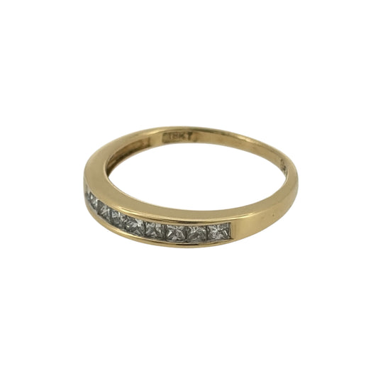 Add an elegant touch to your jewellery collection with this pre-owned 18ct yellow gold and diamond band ring, featuring beautiful princess cut diamonds set across the front of the band for a classic and timeless appearance.
Design: The ring features a traditional diamond-set band design, combining the clean lines of princess cut diamonds with the rich yellow tone of 18ct gold for an elegant finish.
Material: Made from 18ct yellow gold, offering a beautiful warm gold finish that complements the diamonds.