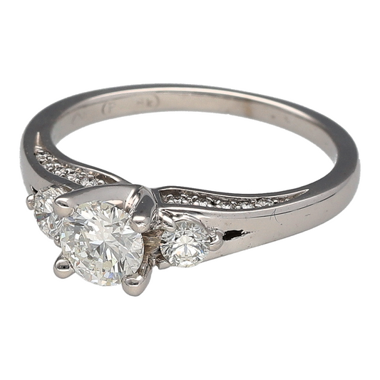 Add a classic three-stone diamond piece to your jewellery collection with this pre-owned 18ct white gold diamond trilogy ring, featuring approximately 0.68ct of diamonds in total.
Design: The ring features a timeless trilogy design, with a larger central brilliant-cut diamond accompanied by a smaller brilliant-cut diamond on either side.
Material: Made from 18-carat white gold, the bright white finish provides a classic setting for the three diamonds.