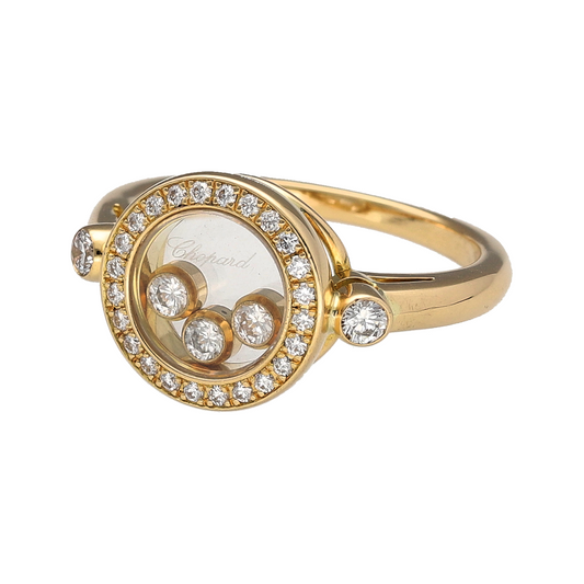 Bring iconic luxury and playful elegance to your collection with this pre-owned 18ct yellow gold diamond set Chopard Happy Ring, featuring signature free-floating diamonds—perfect for collectors or refined everyday style.
Design: The front of the ring measures 11mm high and showcases three brilliant-cut diamonds encased behind a clear panel, designed to move freely within, capturing light and creating joyful sparkle.