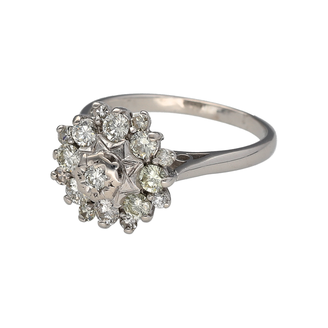 Pre-owned 18ct White Gold & Diamond Set Vintage Style Cluster Ring in size P with the weight 5.60 grams. The front of the ring is 13mm high and there is approximately 0.84ct of diamond content at approximate clarity Si and colour K - M
Bring timeless sparkle and refined style to your collection with this pre-owned 9ct white gold diamond illusion solitaire ring—a classic design with impressive brilliance.