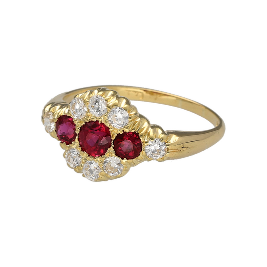 Bring rich colour and vintage elegance to your collection with this pre-owned 18ct yellow gold trilogy ring, styled with rubies and diamonds in a timeless design.
Design: The front of the ring measures 10mm high and features three central rubies framed by surrounding diamonds, creating a bold and eye-catching cluster effect.
Material: Made from 18-carat yellow gold, the polished finish enhances the warm tone and complements the vivid red rubies and sparkling diamonds.