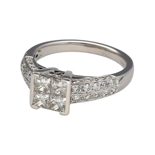 Bring striking sparkle and modern elegance to your collection with this pre-owned 18ct white gold ring, designed with an illusion-set cluster of princess-cut diamonds.
Design: The ring features four princess-cut diamonds set closely together to create the illusion of a single stone, with a combined weight of approximately 0.72ct. Additional diamonds, totalling around 0.40ct, are set along the shoulders for extra brilliance.