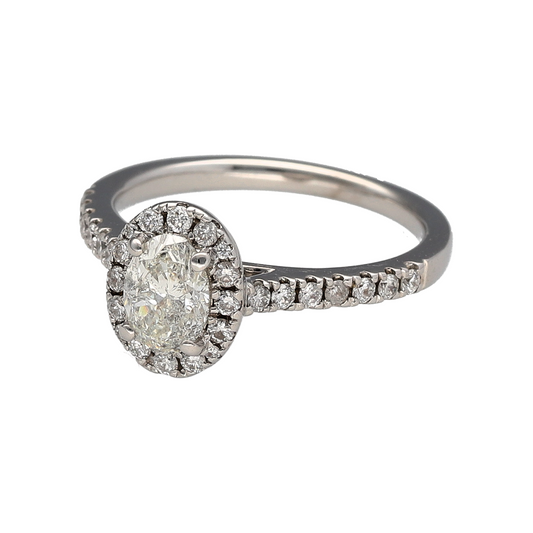 Bring brilliance and timeless glamour to your collection with this pre-owned 18ct white gold diamond oval halo ring—a sparkling design that exudes elegance and sophistication.
Design: The ring features an oval-shaped central diamond surrounded by a halo of smaller diamonds, creating a dazzling display of light and sparkle. With an approximate total diamond weight of 0.60ct and clarity around I1, the ring offers beautiful radiance and presence.