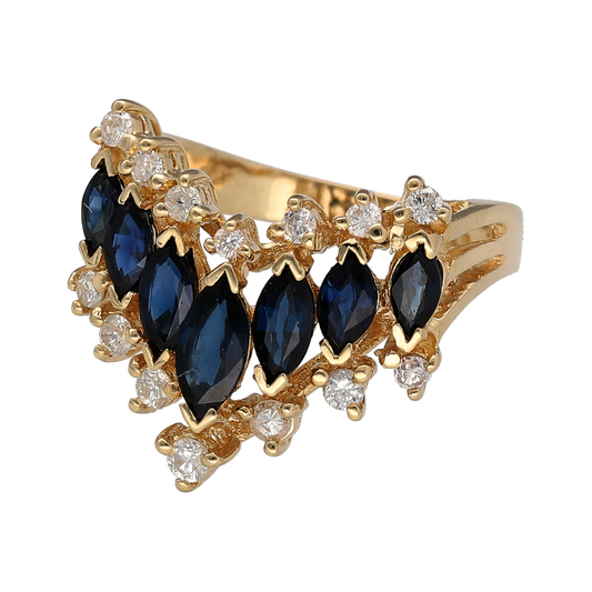 Bring striking colour and refined elegance to your collection with this pre-owned 14ct yellow gold diamond and sapphire wishbone ring—a bold design that blends timeless luxury with graceful sophistication.
Design: The ring showcases a marquise-cut sapphire at the centre, measuring 7mm by 4mm, surrounded by a graduated arrangement of smaller sapphires that flow seamlessly down the band. Two sparkling rows of diamonds, totalling approximately 0.33ct