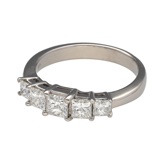 Indulge in timeless brilliance with this pre-owned 18ct yellow gold diamond set princess cut five stone band ring—an elegant and substantial piece perfect for anniversaries, milestone moments or standout everyday luxury.
Design: The ring features five beautifully matched princess cut diamonds arranged in a classic row across the front, creating a sleek and contemporary silhouette. The square-cut stones sit neatly side by side, offering clean lines and impressive light reflection.