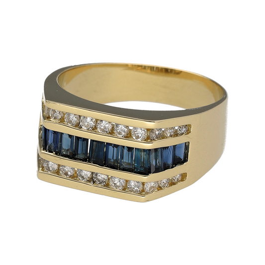 Add bold elegance and striking colour to your collection with this pre-owned 14ct yellow gold diamond and sapphire three-row ring, combining luxurious gemstones with a statement design—perfect for evening wear or standout everyday style.
Design: The ring features two outer rows of brilliant-cut diamonds, totalling approximately 0.72ct, framing a central row of baguette-cut sapphires for a refined contrast of sparkle and deep blue hue.