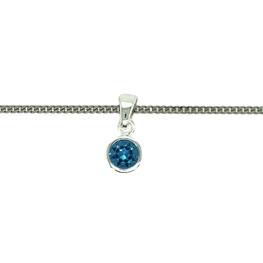 New 925 Silver December Birthstone Pendant on either an 18" or 20" curb chain. The pendant is set with a synthetic blue turquoise stone which is 5mm diameter. The pendant is 14mm long including the bail