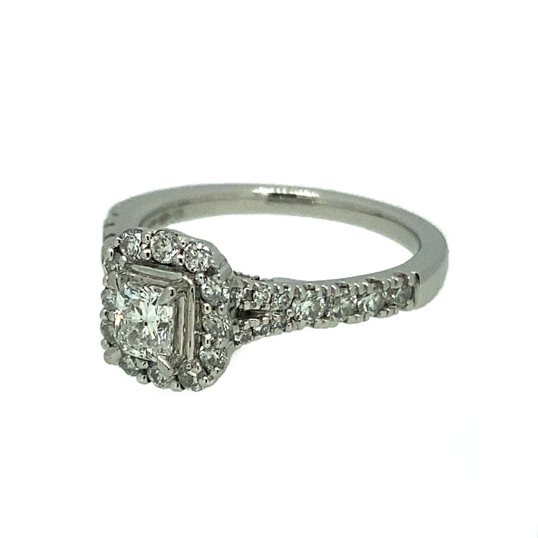 The style of this masterpiece is an instant classic. With a princess cut centre diamond, featuring a halo and accompanying shoulders set with smaller diamonds, there is a timelessness about this ring that is difficult to put into words. Platinum was a perfect choice metal for this ring, such a rare and unique style deserves a metal to match