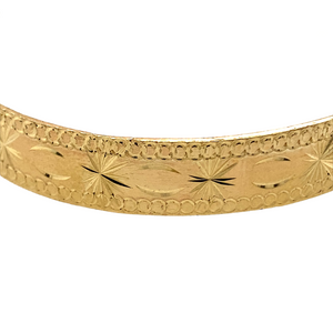 New 9ct Yellow Solid Gold Patterned Children's Bangle with the weight 13 grams. The width of the bangle is 9mm and the diameter is 5.5cm