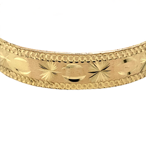 New 9ct Yellow Solid Gold Patterned Baby Bangle with the weight 10.70 grams. The width of the bangle is 9mm and the diameter is 4.5cm