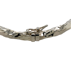 A New Silver Twisted Hinged Bangle with the weight 8.60 grams and bangle width 5mm. The bangle diameter is 6cm