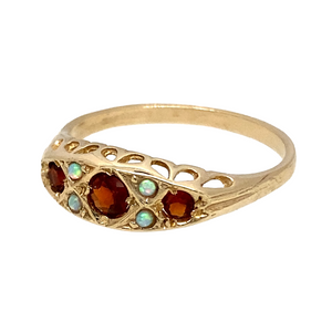 New 9ct Yellow Gold & Created Opal & Dark Red Stones Set Ring in various sizes with the weight 1.70 grams. The front of the ring is 6mm high and the center red stone is 3mm diameter