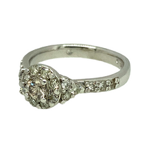 Load image into Gallery viewer, Preowned Platinum &amp; Diamond Set Halo Ring with Diamond set shoulders in size H with the weight 4.20 grams. There is approximately 40pt of Diamonds and the center stone is approximately 10pt. The Diamonds are approximately clarity Si1 and colour M - N
