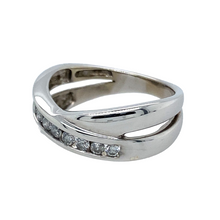 Load image into Gallery viewer, Preowned 9ct White Gold &amp; 25pt Diamond Set Crossover Ring in size K to L with the weight 3.80 grams. The band is 7mm at the widest 
