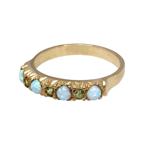 New 9ct Yellow Gold & Created Opal & Green Stone Band Ring in various sizes with the weight 2.10 grams. The band is approximately 4mm wide at the front and the created opal stones are 3mm diameter each