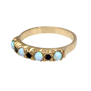 New 9ct Yellow Gold & Created Opal & Navy Stone Band Ring in size O with the weight 2.20 grams. The band is approximately 4mm wide and the created opal stones are 3mm diameter each