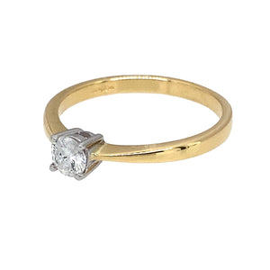 Preowned 18ct Yellow and White Gold & Diamond Brilliant Cut Set Solitaire Ring in size L with the weight 2.20 grams. The Diamond is approximately 25pt with approximate clarity i1 - i2 and colour K - M
