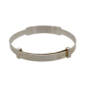 A New Silver Diamond Cut Kiss Identity Expander Bangle with the weight 4.50 grams. The bangle is approximately 6.5mm wide and the rest of the bangle is 4mm wide. The bangle diameter is 4.1cm when closed and 5.1cm when fully expanded