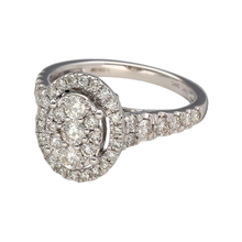 Load image into Gallery viewer, New 9ct White Gold &amp; Diamond Oval Halo Ring with Diamond set shoulders. The ring is in size M with the weight 3.60 grams. There is approximately 1ct of Diamonds set in the ring in total. The front of the halo is 13mm high. Other sizes available, enquire in the contact page
