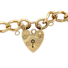 Load image into Gallery viewer, Preowned 9ct Yellow Gold 7&quot; Charm Bracelet with a heart padlock. The bracelet has the weight 13.60 grams and the link width 7mm 
