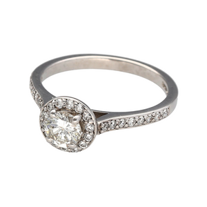 A beautiful halo of Diamonds surrounds a stunning centrepiece Diamond, raised above the rest of the ring to showcase its glorious light. Diamonds continue down the shoulders as well as under the central stone's setting for a high detail, intricate design that really showcases immense attention to detail. White Gold is a fantastic choice for this piece, the Diamonds perfectly matching the colour of the Gold, allowing them to steal the show! The approximate Diamond weight of this piece is 0.51ct