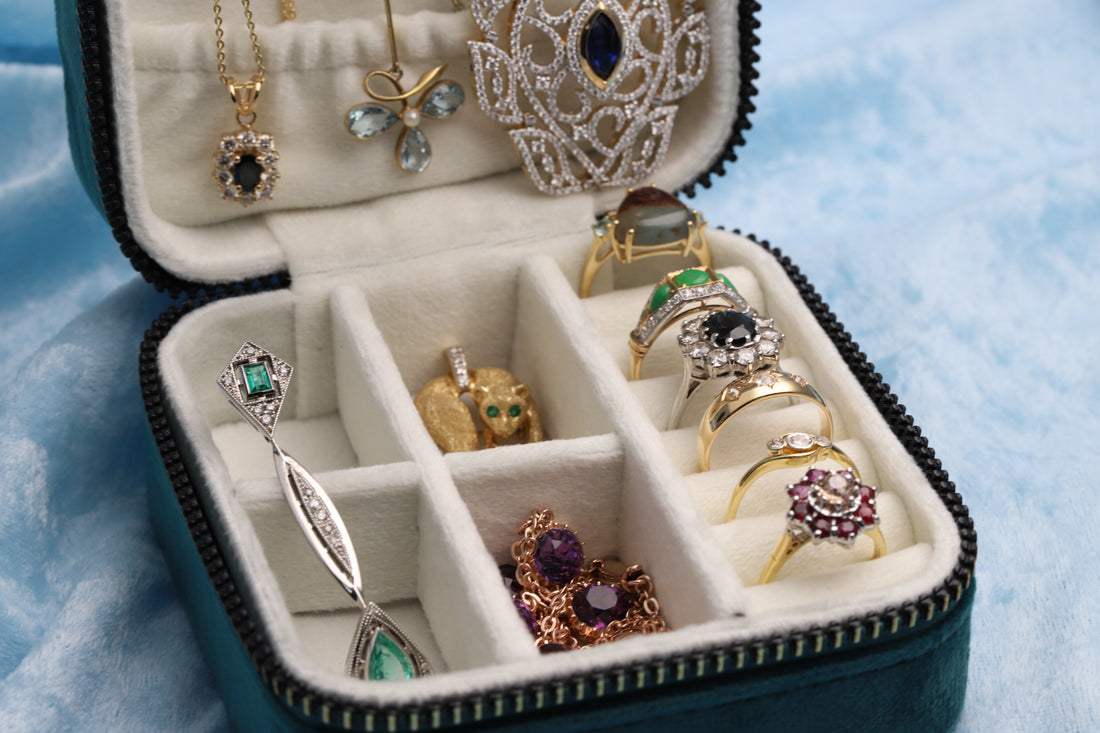 Jewellery box filled with jewellery such as diamond set rings, pendants and necklaces
