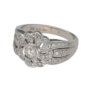 Preowned 18ct White Gold & Diamond Set Flower Ring in size L with the weight 5.90 grams. There is approximately 50pt of diamond content set in total and the front of the ring is is 12mm high