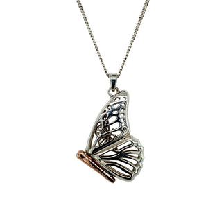 Bring whimsical beauty and heartfelt symbolism to your collection with this pre-owned 925 silver with 9ct rose Clogau gold butterfly locket pendant on an 18" Clogau curb chain, blending elegant craftsmanship with a touch of wonder—perfect for gifting or treasured keepsakes.

Design: The 3.5cm long pendant (including the bail) features an intricately shaped butterfly in sterling silver with rose gold accents. Inside, a smaller butterfly is revealed when the locket opens, symbolising transformation