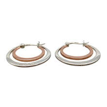 Load image into Gallery viewer, Bring elegant contrast and heritage style to your collection with these pre-owned Clogau double hoop creole earrings in sterling silver and 9ct rose gold, offering timeless design with a modern twist—perfect for both everyday wear and special occasions.

Design: Each earring features an interlocking double hoop creole style, combining flowing curves with a distinctive two-tone look.

