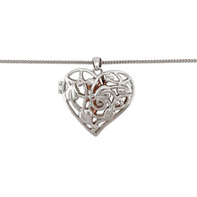 Load image into Gallery viewer, Hold a little magic close to your heart with this pre-owned 925 silver and 9ct rose gold Clogau Tree of Life heart fairy locket—an enchanting design blending heritage, symbolism, and imagination.

Design: This beautifully crafted locket features a heart-shaped design adorned with the iconic Tree of Life motif and a delicate fairy figure. Measuring 3.1cm long including the bail, it opens to hold a cherished photo or keepsake.


