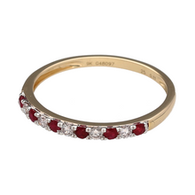 Load image into Gallery viewer, Bring subtle colour and classic sparkle to your jewellery collection with this new 9ct yellow gold diamond and ruby band ring—a delicate piece with timeless charm and refined detail.

Design: The 2mm wide front of the band features alternating ruby and diamond accents, with approximately 0.11ct of total diamond content for a soft, elegant sparkle.
Material: Made from 9-carat yellow gold, the polished finish adds warmth and beautifully contrasts with the vibrant red rubies and bright diamonds.

