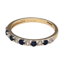 Load image into Gallery viewer, Bring refined colour and classic sparkle to your jewellery collection with this new 9ct yellow gold diamond and sapphire band ring—a delicate piece with timeless elegance and subtle detail.

Design: The 2mm wide front of the band features alternating 2mm round sapphire stones and diamond accents, creating a balanced and graceful look.
Material: Made from 9-carat yellow gold, the polished finish adds warmth and complements the deep blue sapphires and sparkling diamonds.

