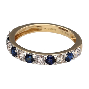 Bring rich colour and timeless sparkle to your jewellery collection with this new 9ct yellow gold diamond and sapphire band ring—a classic piece with bold elegance and refined detail.

Design: The 3mm wide front of the band features 3mm round sapphire stones alternating with diamonds, offering a striking look with approximately 0.50ct of total diamond content.
