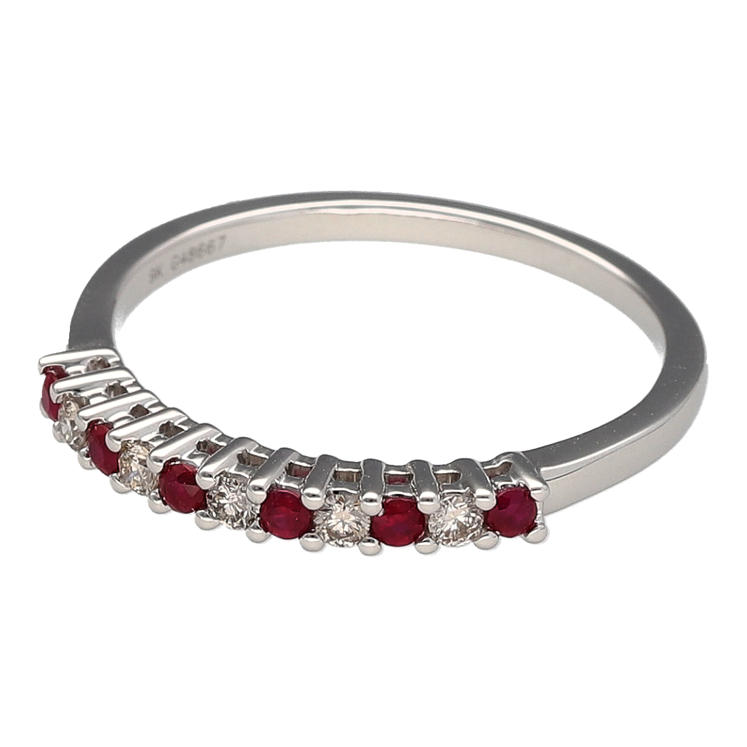 Bring refined sparkle and vibrant colour to your collection with this new 9ct white gold diamond and ruby set band ring, offering a beautiful blend of classic elegance and modern detail—perfect for adding a touch of luxury to any look.

Design: The ring features alternating ruby stones, each approximately 1.5mm in diameter, and shimmering diamonds with a total diamond content of approximately 0.12ct, creating a graceful and balanced pattern across the band.
