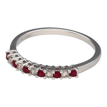 Load image into Gallery viewer, Bring refined sparkle and vibrant colour to your collection with this new 9ct white gold diamond and ruby set band ring, offering a beautiful blend of classic elegance and modern detail—perfect for adding a touch of luxury to any look.

Design: The ring features alternating ruby stones, each approximately 1.5mm in diameter, and shimmering diamonds with a total diamond content of approximately 0.12ct, creating a graceful and balanced pattern across the band.

