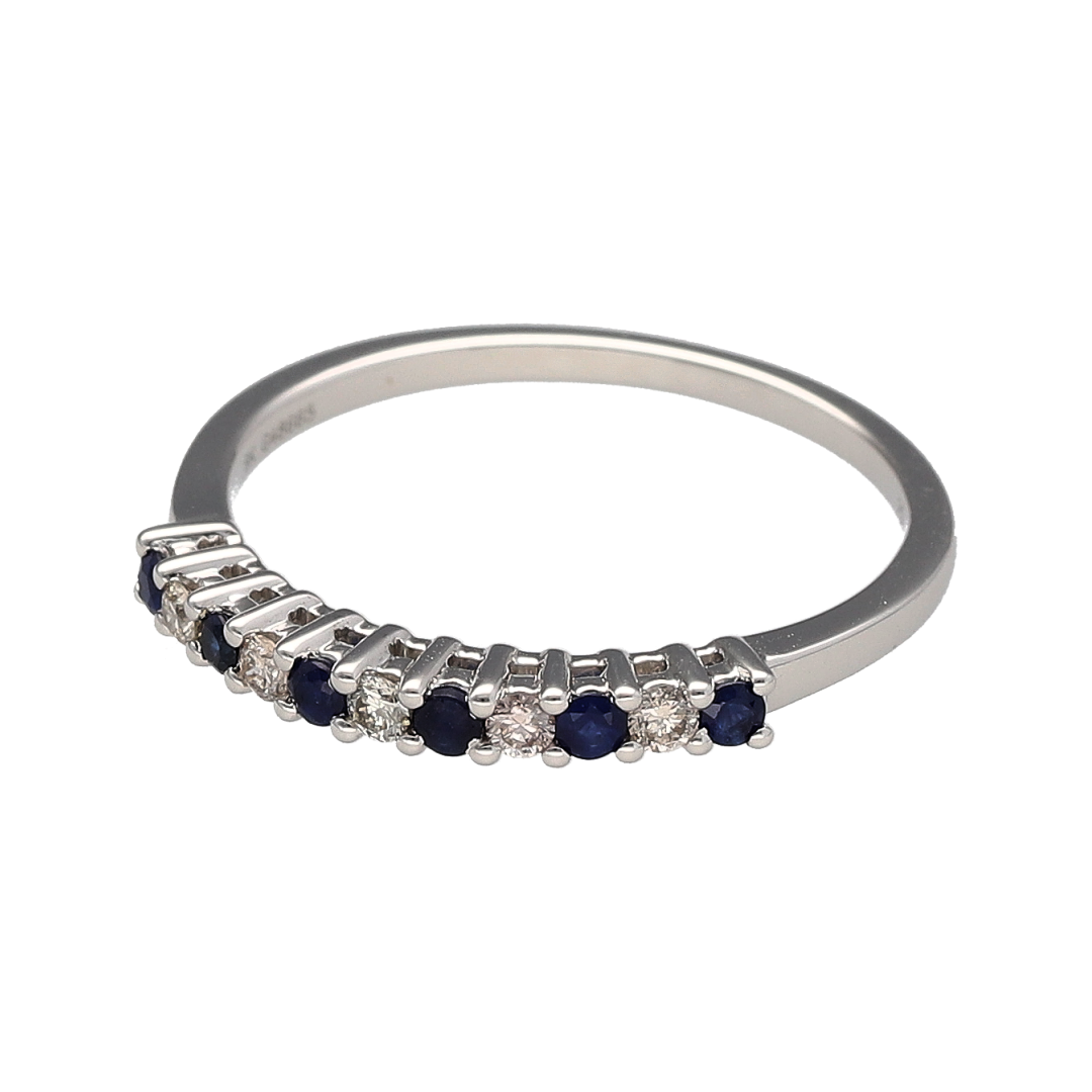 Bring refined sparkle and timeless elegance to your collection with this new 9ct white gold diamond and sapphire set band ring, offering a stunning blend of classic sophistication and vibrant detail—perfect for adding a touch of luxury to any look.

Design: The band features alternating sapphires and diamonds, with approximately 0.12ct of total diamond content, creating a graceful and eye-catching pattern that adds both colour and brilliance.
