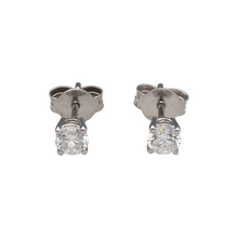 Load image into Gallery viewer, Bring refined sparkle and timeless elegance to your collection with these new 9ct white gold diamond stud earrings—a classic pair with impressive brilliance.

Design: Each earring is claw-set with a brilliant-cut diamond, together totalling approximately 0.51ct–0.55ct, creating a radiant and eye-catching look.
Material: Made from 9-carat white gold, the polished finish enhances the fire and brilliance of the diamonds while adding modern appeal.

