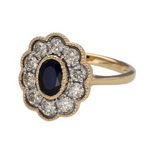 Load image into Gallery viewer, New 9ct Yellow and White Gold Diamond &amp; Sapphire Set Cluster Ring in size N with a beaded edge detail. The front of the ring is 16mm high and the sapphire stone is approximately 6.5mm by 4.5mm. There is approximately 0.85ct of real natural diamonds set in the cluster in total
