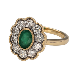 New 9ct Yellow and White Gold Diamond & Emerald Set Cluster Ring in size N with a beaded edge detail. The front of the ring is 16mm high and the emerald stone is approximately 6.5mm by 4.5mm. There is approximately 0.85ct of real natural diamonds set in the cluster in total