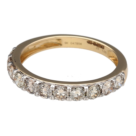 Add bold brilliance and timeless elegance to your collection with this pre-owned 9ct yellow gold diamond set band ring—perfect for standout sparkle in a refined design.

Design: The 3mm wide front of the band is set with eleven brilliant cut diamonds, offering continuous shimmer and classic symmetry.
Material: Made from 9-carat yellow gold, the polished finish enhances the radiant sparkle of the diamonds with a warm, golden glow.
