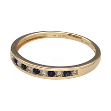 Load image into Gallery viewer, Bring refined sparkle and rich colour to your collection with this new 9ct yellow gold diamond and sapphire set band ring—perfect for elegant everyday wear or meaningful gifting.

Design: The 3mm wide band features a sleek row of channel-set sapphires and diamonds, offering a smooth, modern profile with classic contrast.
Material: Made from 9-carat yellow gold, the polished finish enhances the deep blue sapphires and the brilliance of the diamonds.

