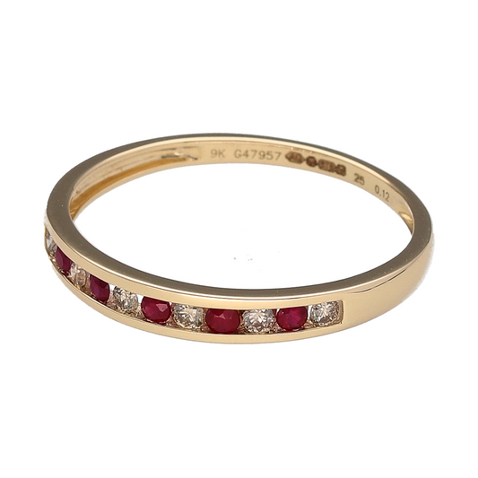 Bring vivid colour and timeless sparkle to your collection with this new 9ct yellow gold diamond and ruby set band ring—perfect for elegant layering or a meaningful gift.

Design: The 3mm wide band features a row of channel-set rubies and diamonds, creating a sleek and vibrant contrast in a smooth profile.
Material: Made from 9-carat yellow gold, the polished finish complements the deep red of the rubies and the brilliance of the diamonds.
