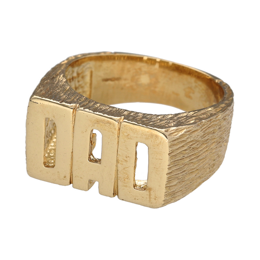 Bring bold sentiment and timeless style to your collection with this new 9ct gold Dad ring—a classic design that celebrates fatherhood with strong lines and lasting presence.

Design: The ring features a 12mm high front with the word "DAD" proudly displayed in bold, raised lettering, set within a polished frame for a clean and impactful look.
Material: Made from solid 9-carat gold, the high-shine finish enhances the lettering and gives the piece a warm, luxurious glow.
