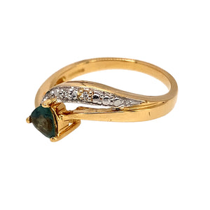 Preowned 18ct Yellow and White Gold Diamond & Green Stone Set Dress Ring in size N with the weight 3.50 grams. The green stone is 5mm by 5mm by 5mm